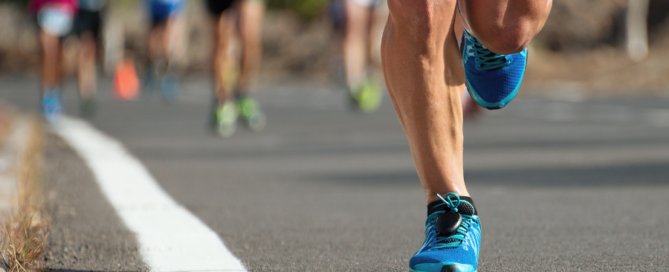 leg shot of a group of people participating in a marathon