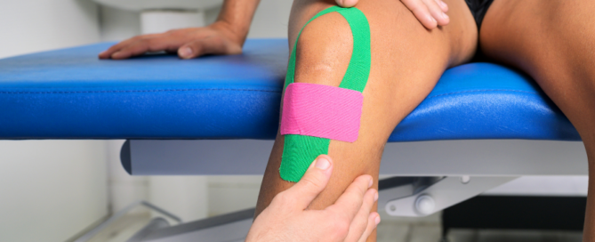 Kinesio tape being applied to knee