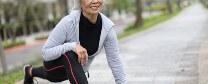 woman doing leg and hip stretches outside