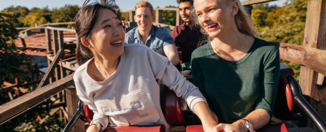 kids riding roller coaster