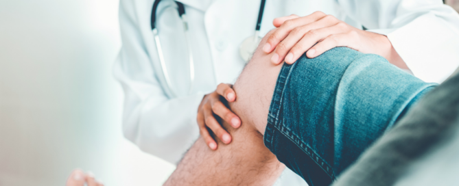 medical professional examining patient knee