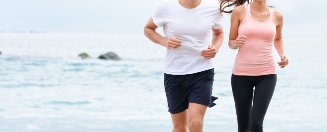 couple jogging on the beach