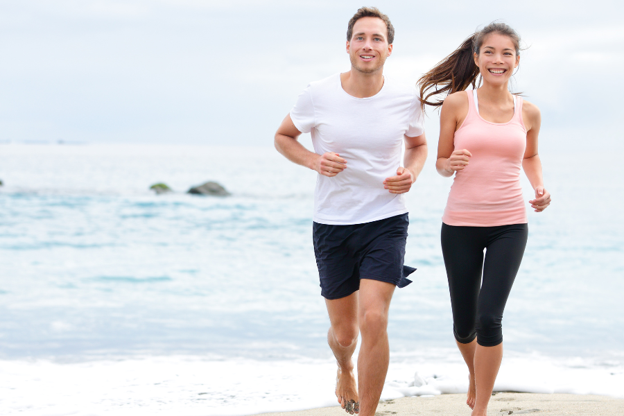 couple jogging on the beach
