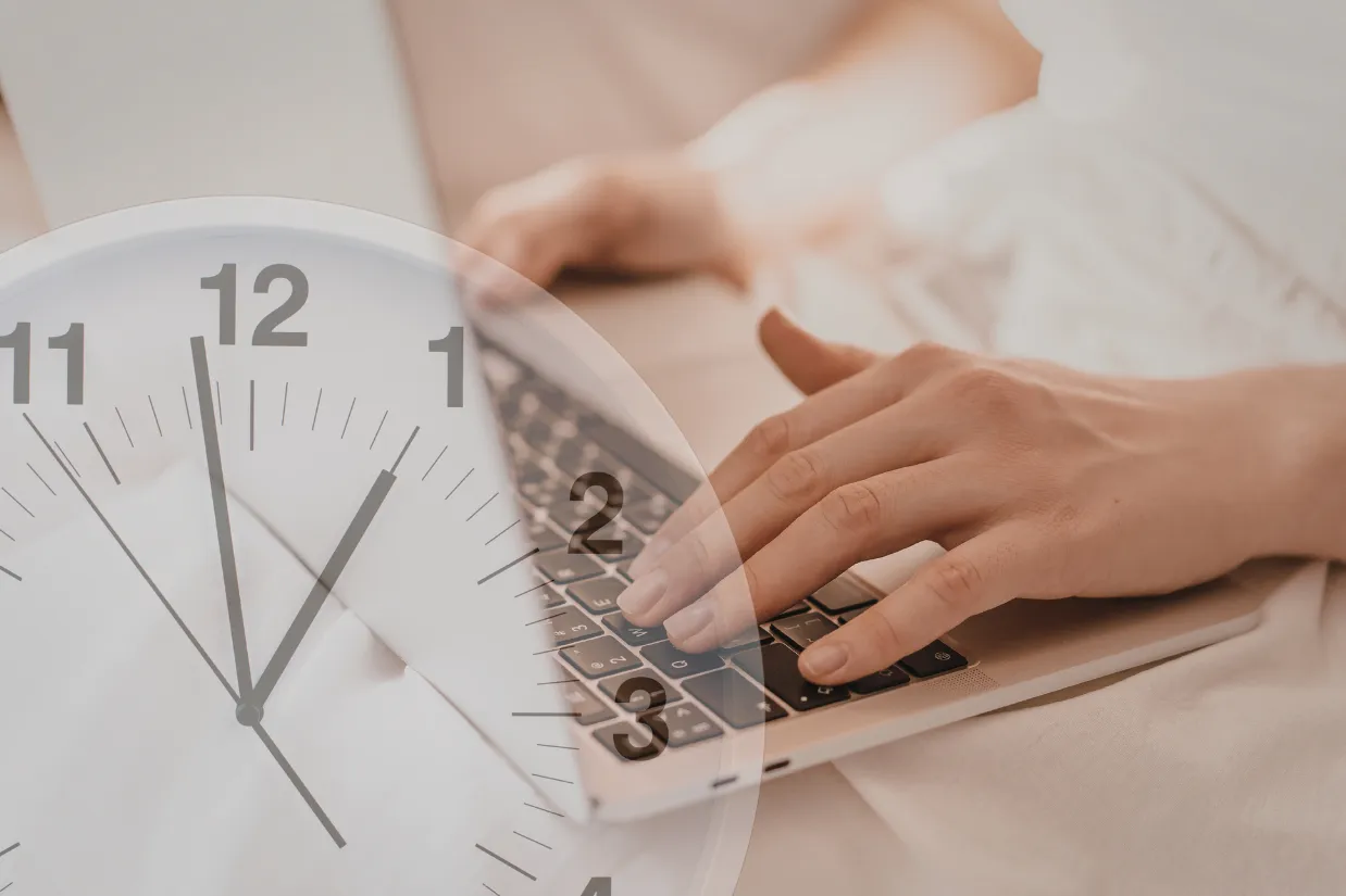 Person typing on a laptop for long hours, illustrating repetitive motion linked to carpal tunnel symptoms